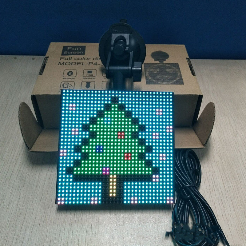 A vibrant square LED car display showcasing colorful emoticons and text, controlled via Bluetooth app.